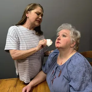 Rose tends to Hazel during a tense moment in The Children, where buried secrets and haunting choices come to light