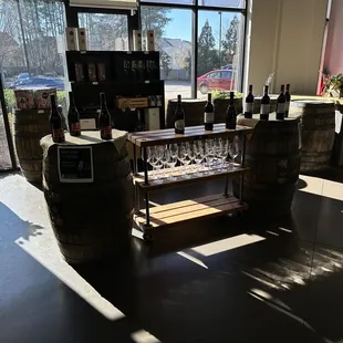 a display of wine glasses and barrels