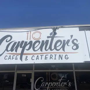 a sign for carpenters cafe and catering
