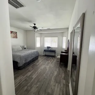 a bedroom with a bed and a desk