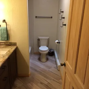 a bathroom with a toilet and sink