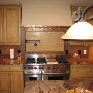 a kitchen with granite countertops