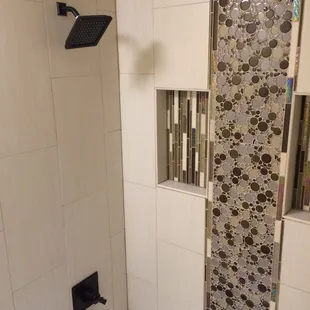 a bathtub and shower in a bathroom