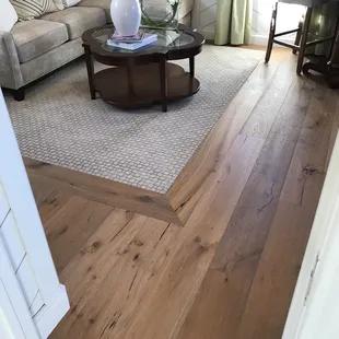 a living room with hardwood floors