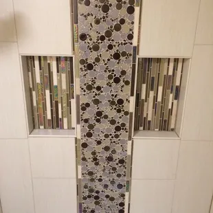 a bathroom with a tiled shower