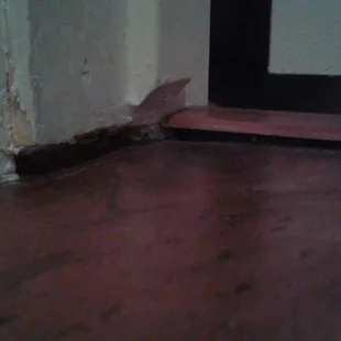Un even door frame and flooring not sealed properly