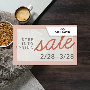 a coffee cup, mug of coffee, and a pile of nuts