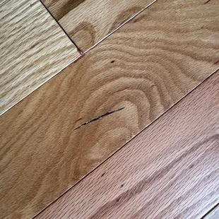 Damaged wood glued down permanently.