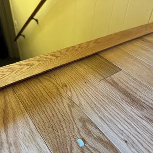 Stair nose that is not only a trip hazard going downstairs, but sharp and weird looking!