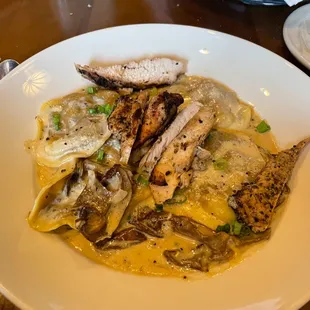 Mushroom Ravioli - a medley of mushrooms in a porcini cream sauce (added chicken)