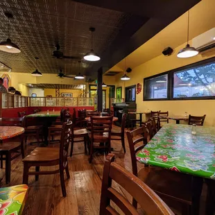 Inside. Dining room. Facing towards entrance. Fast-casual restaurant setup.