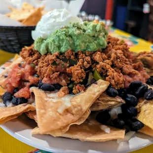 Nachos. $8.75. Black beans, guacamole (+$3.75), housemade corn and flour chips, Monterey Jack cheese, sour cream, jalapenos, salsa fresca.