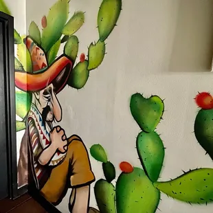 Intriguing wall art right at the end of hallway