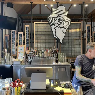 a man working behind the bar