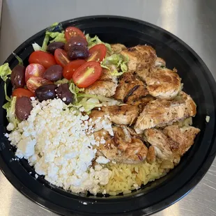 a plate of chicken, rice and vegetables
