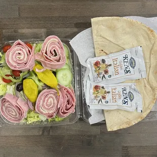 ham, cheese, lettuce, tomatoes, cucumber, and pickles