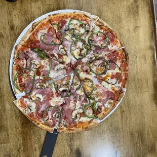 a pizza on a wooden table
