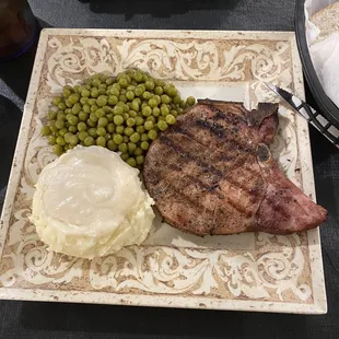 Smoked pork chop, peas, mashed potatoes with milk gravy. I also had their sweet corn nuggets and sweet tea.