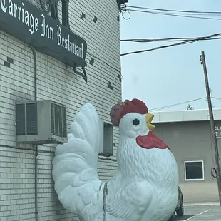 a large chicken on a chain
