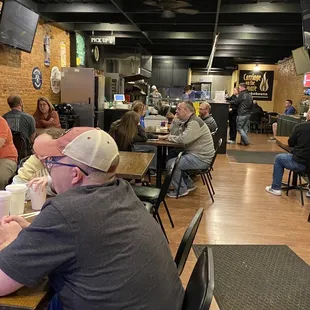 Everyone eating and having a good time.