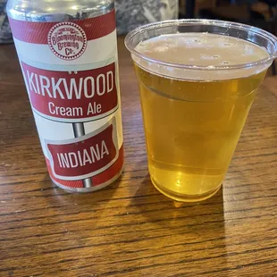 a can and a glass of beer