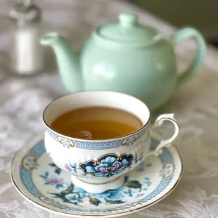 a teapot and a cup of tea