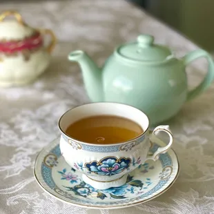 a teapot and a cup of tea