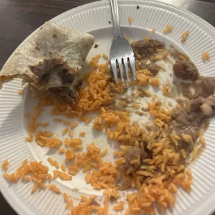 Leftover rice was a shredded beef burrito.