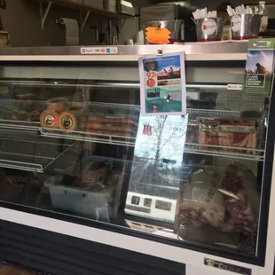 Local meats, eggs, honey, sauces, some produce, and smoked meats and prepared sides to-go.