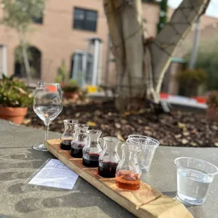 a flight of wine glasses on a table