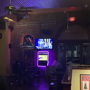 a bar with a neon sign