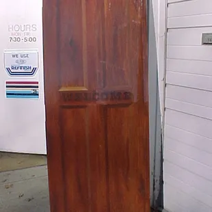 This is a flat steel fire rated door made to look like paneled wood.