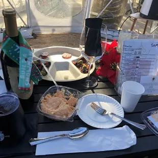 a picnic table with food and drinks
