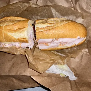 BYO sandwich with Turkey, chicken, olives, pepper and ranch on a baguette