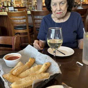 Italian fries=fried dough, grated Parmesan, marinara. This is my gorgeous Mom/Dr. Barbara Keller of Upper Arlington.