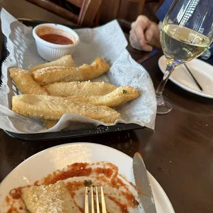 These are the unique and delicious Italian Fries w/Parmesan cheese and marinara sauce. It was new to us. It was delicious! $4 happy hour.