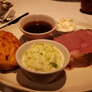 a plate of meat and sides