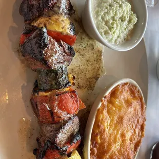Steak on a stick with vegetables, macaroni N' cheese, Cole slaw