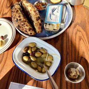Olives and sardines with bread