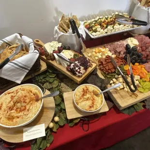 Hummus, pita chips, cheese, Tuscano appetizers, meat and fruit spread.