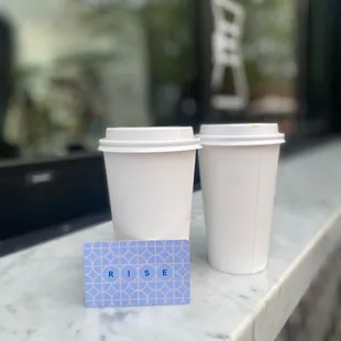 two cups of coffee on a counter