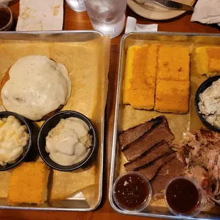 two trays of food on a table