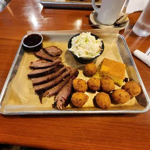 Brisket, hush puppies, coleslaw.