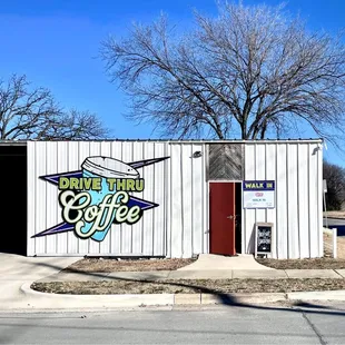 a white building with a sign on it