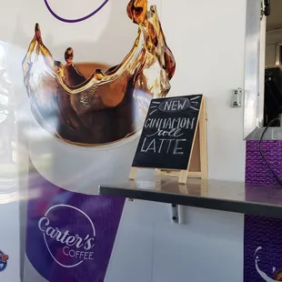 a coffee shop with a large cup of coffee