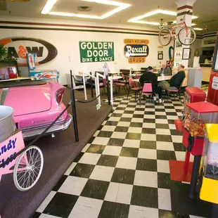 a pink car in a diner