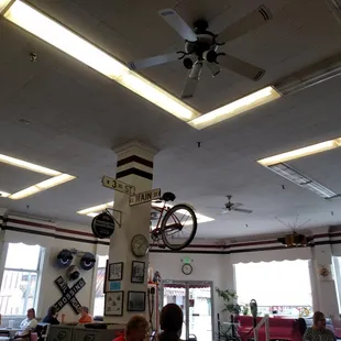 a bicycle hanging from the ceiling
