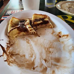 Cream cheese stuffed crepes w chocolate syrup