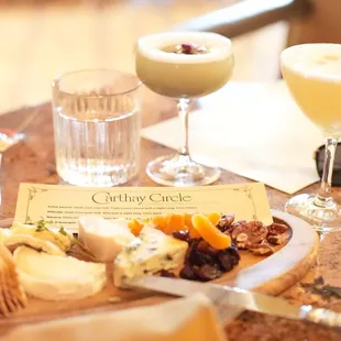 Charcuterie board with Pisco Sour and Tequila Daisy