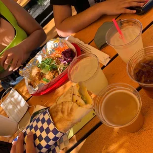 people eating at a picnic table